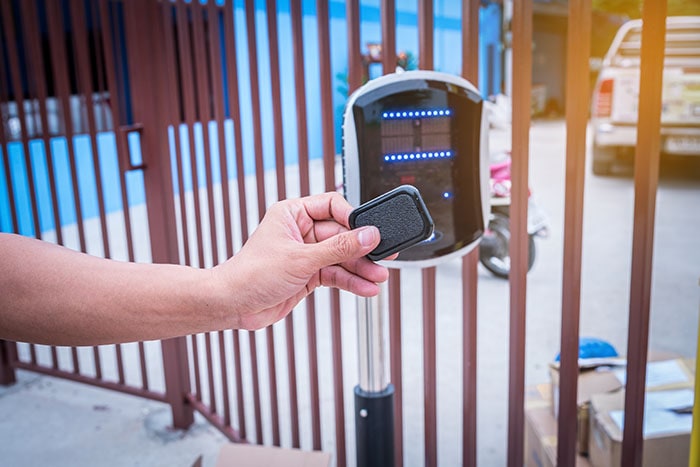 Automated security entry systems on the gatepost of a residence.