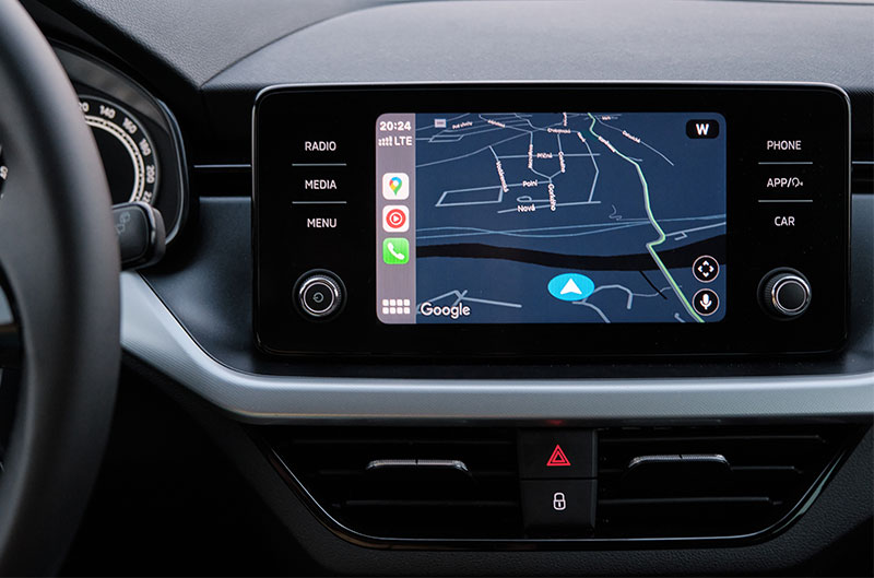 A close up of the infotainment system in a car showing a map on the screen