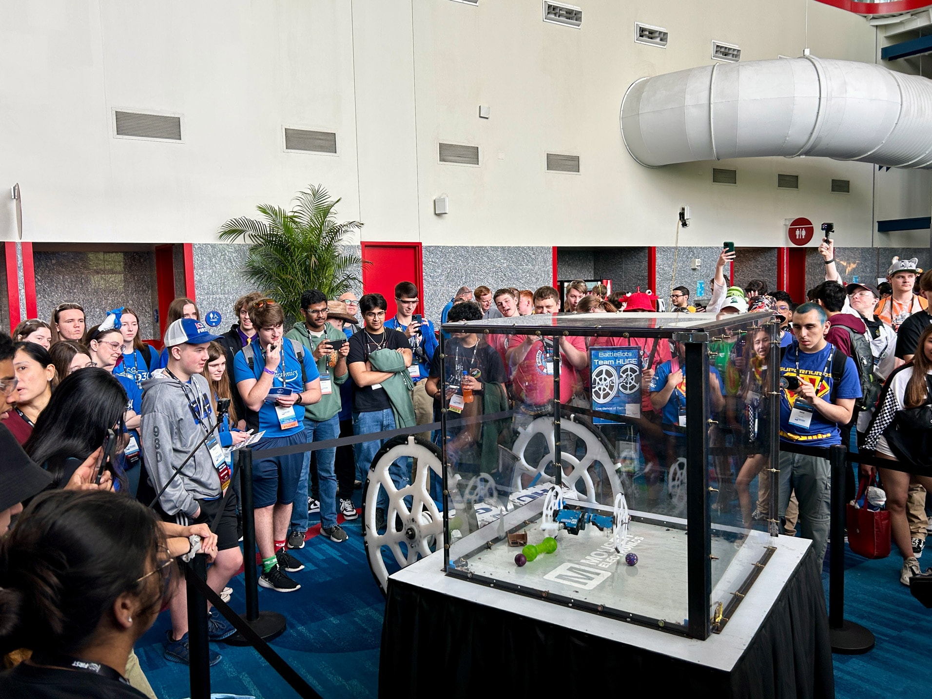 view of students around robot display